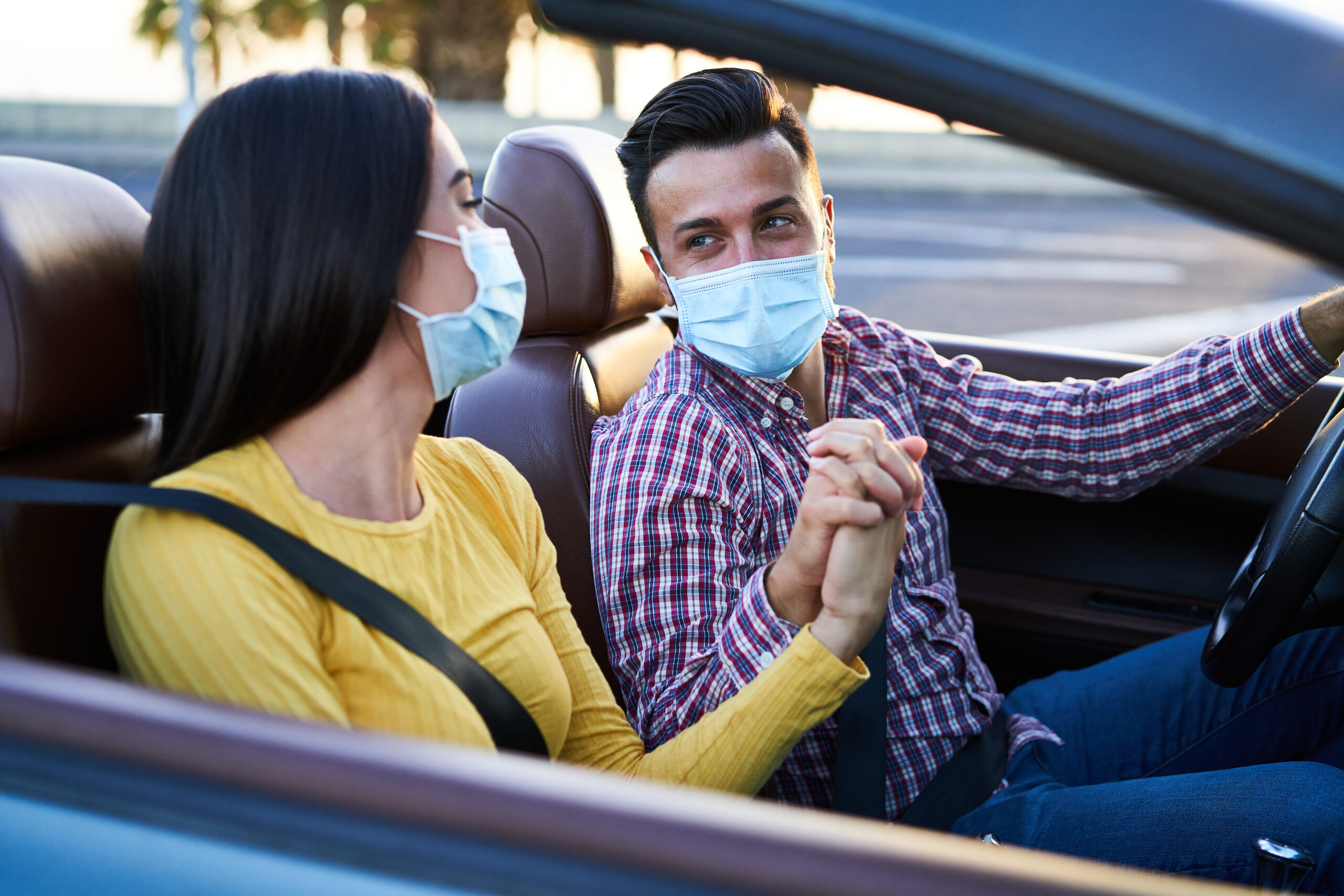 couple on journey wearing masks