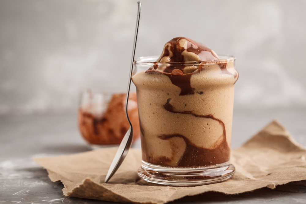 keto friendly smoothies Vegan chocolate ice cream in a glass jar. Healthy dessert. Clean eating.