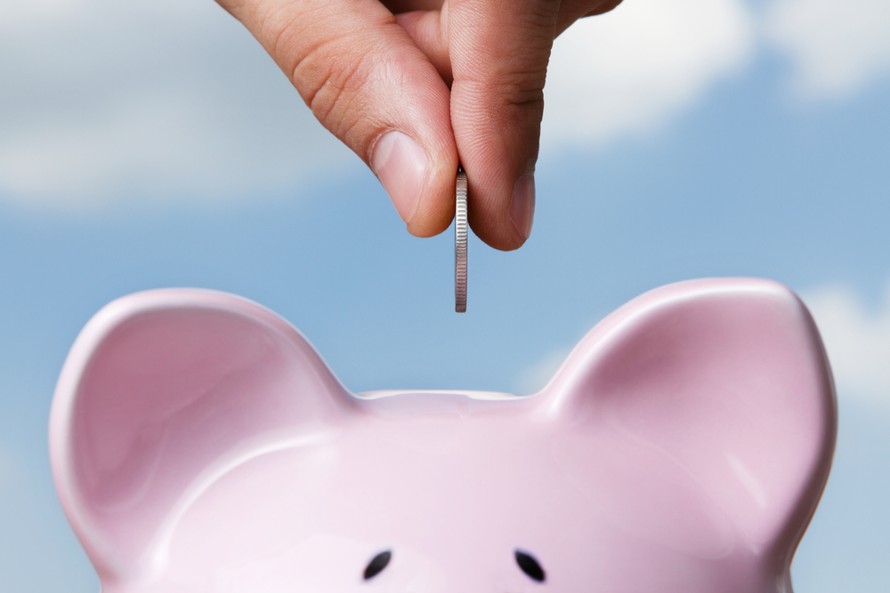 fill the piggy bank money is linked to happiness