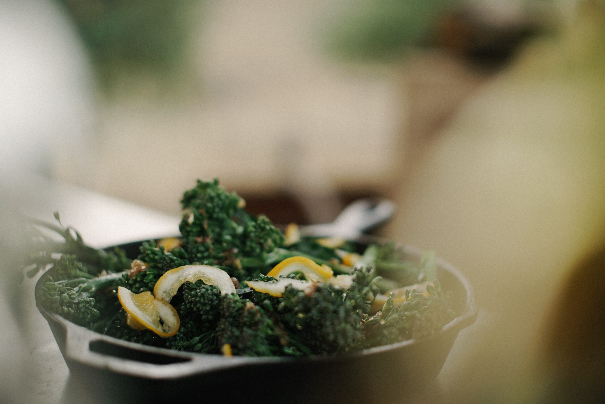 Steamed broccolini with lemon, toasted pine nuts, and extra virgin olive oil