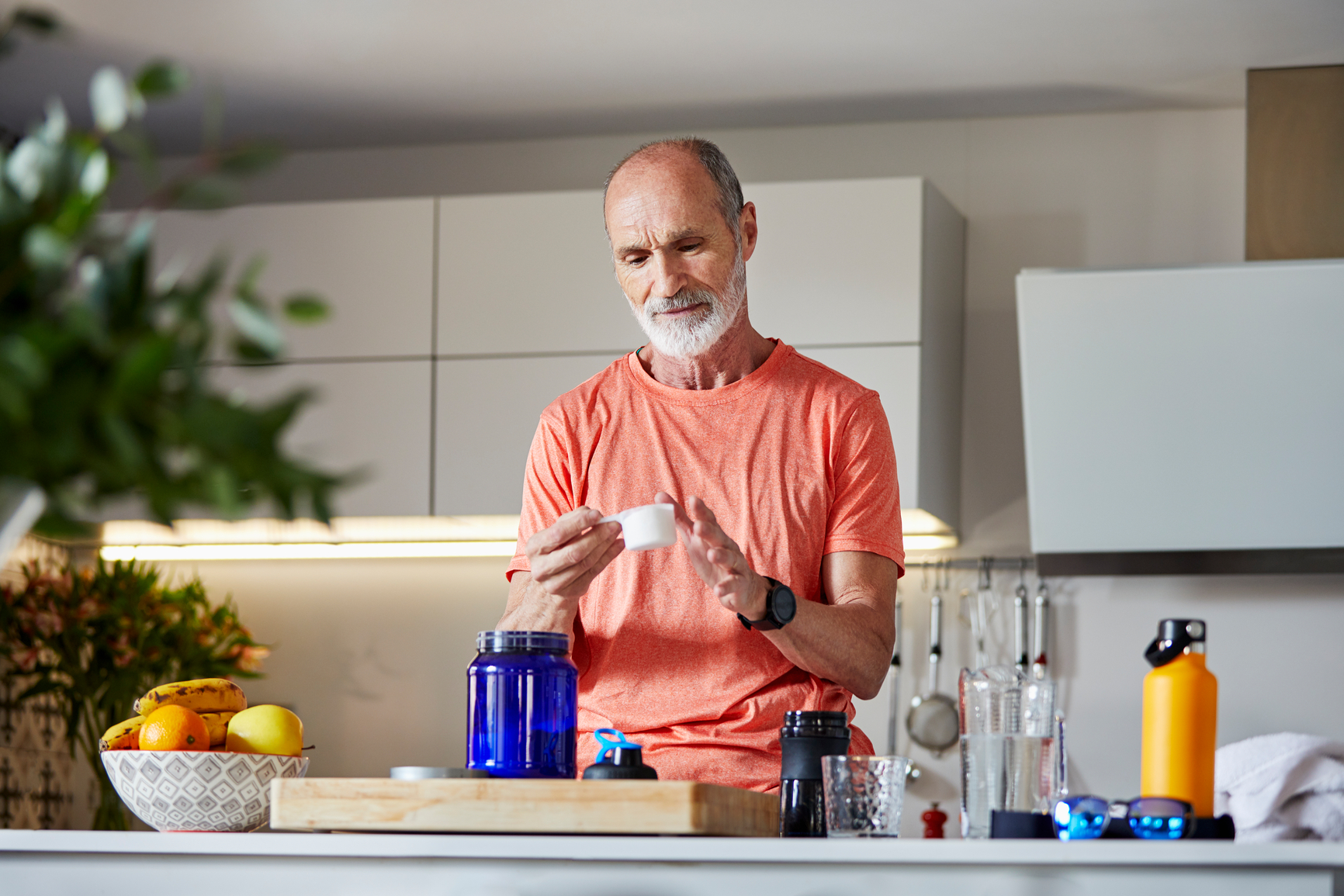 Active Senior Man Preparing Protein Drink