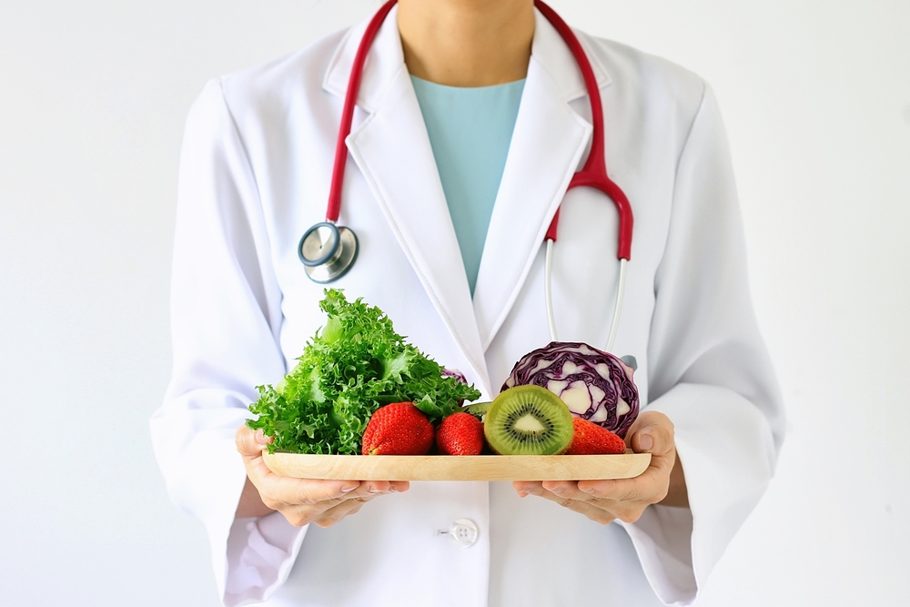personalized nutrition for you. Doctor holding fresh fruit and vegetable, Healthy diet, Nutrition food as a prescription for good health.
